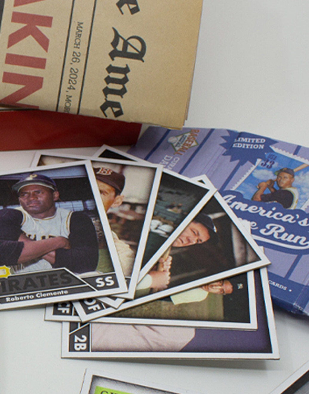 Close up of player cards fanned out on a table with package wrapping underneath