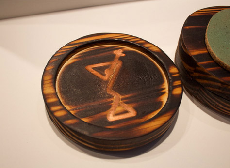 Wooden coaster with bronze inlay of a martini glass